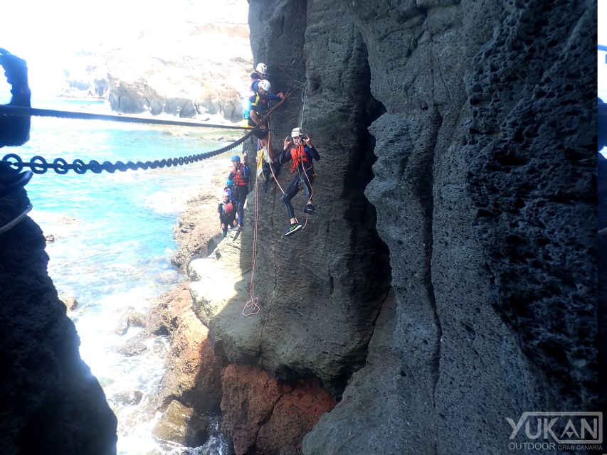 Las Palmas: Coastering, Via Ferrata, Water Jumping & Snorkel - Via ferrata-style moves, suspension bridge, and abseiling